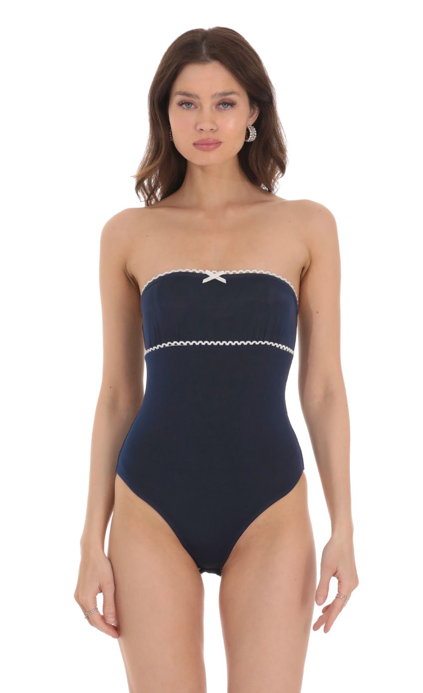 Picture Strapless White Accent Bodysuit in Navy. Source: https://media-img.lucyinthesky.com/data/Jan24/850xAUTO/91c4b8f0-ab72-43c4-9a1f-3369791b764d.jpg