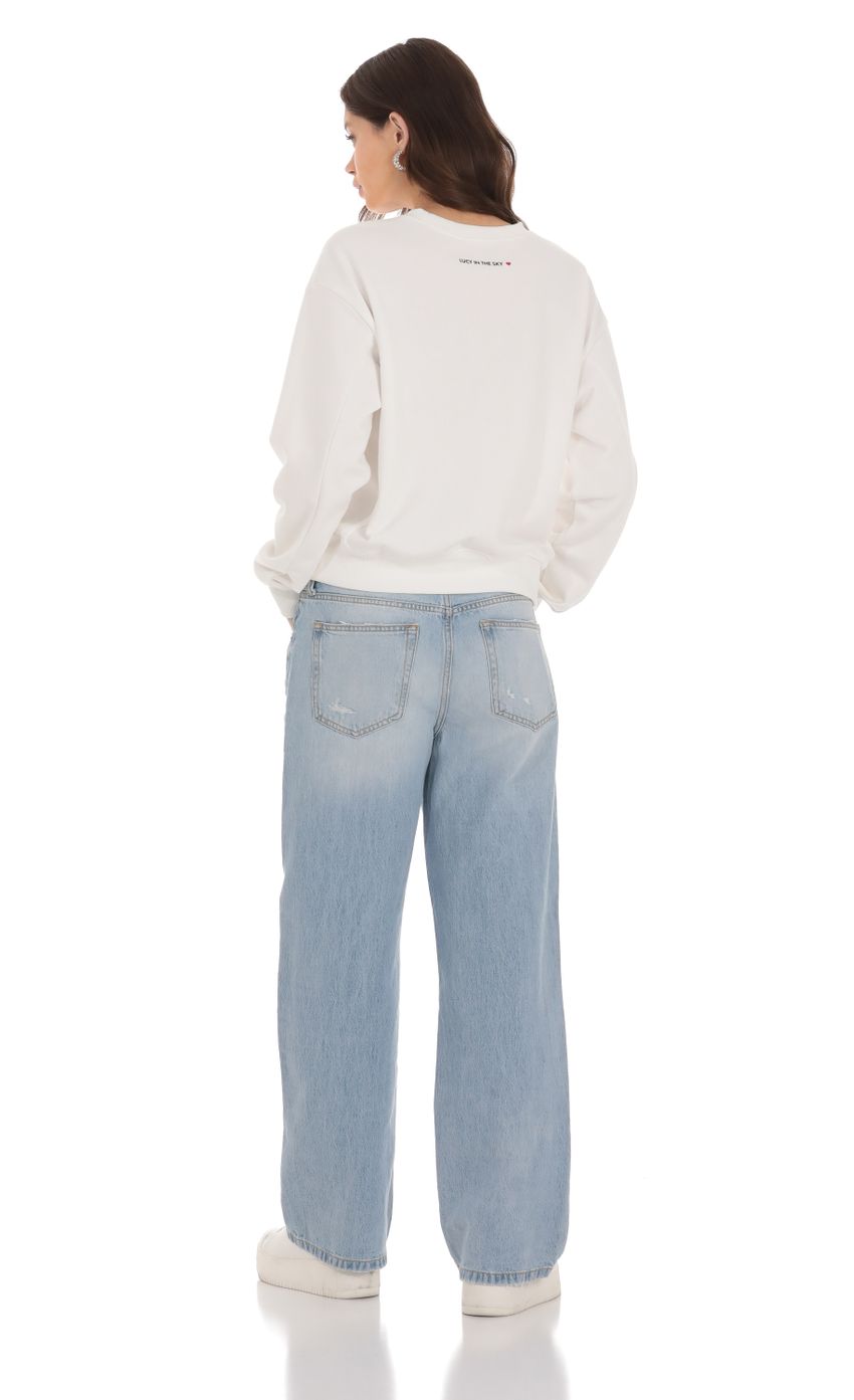 Picture Wide Leg Jeans in Faded Denim. Source: https://media-img.lucyinthesky.com/data/Jan24/850xAUTO/92207bd5-997f-43d6-bece-465d0a710740.jpg