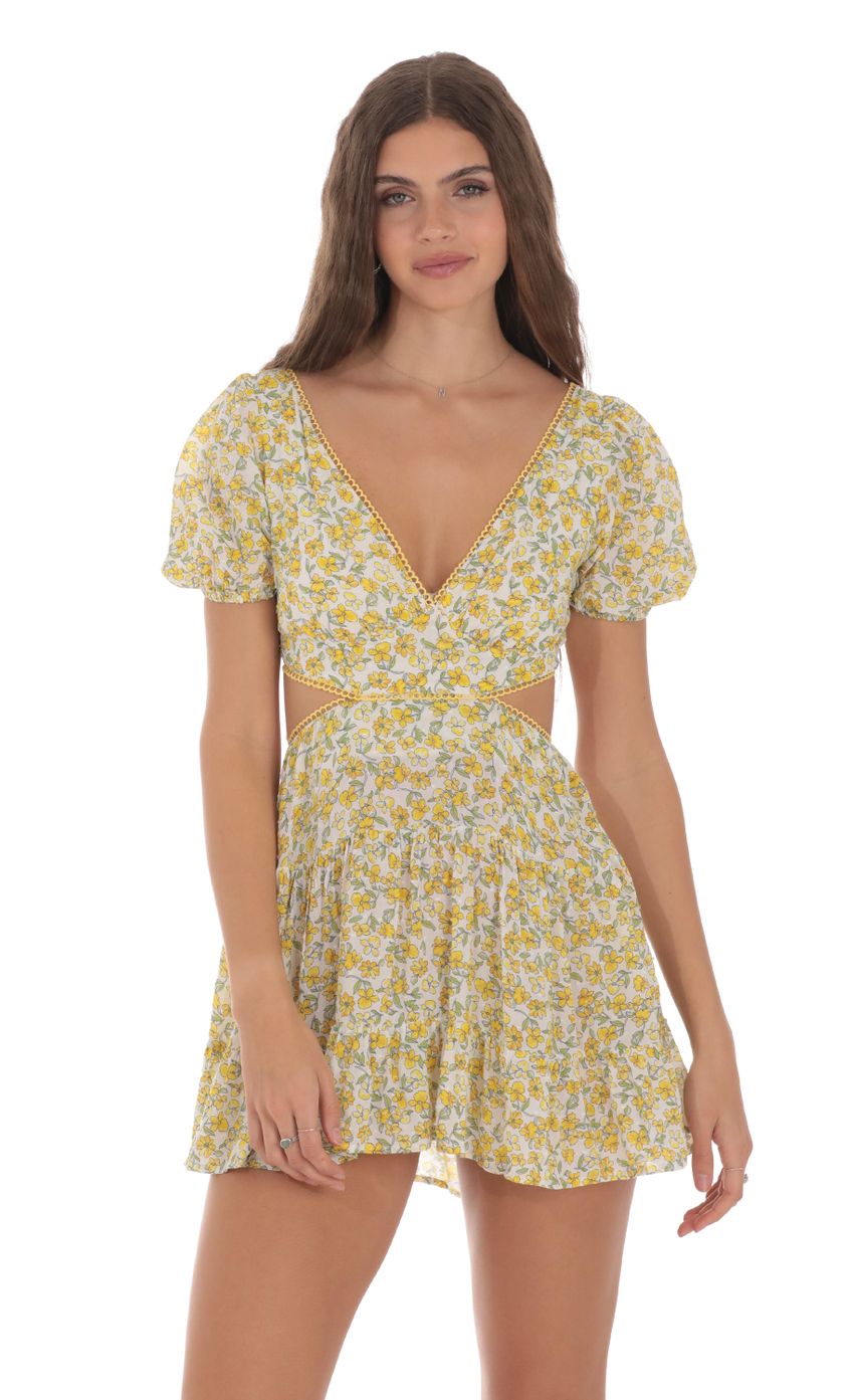 Picture Yellow Floral Cutout Dress in White. Source: https://media-img.lucyinthesky.com/data/Jan24/850xAUTO/958a2ee1-4ad6-44bc-9862-845ad2528bde.jpg