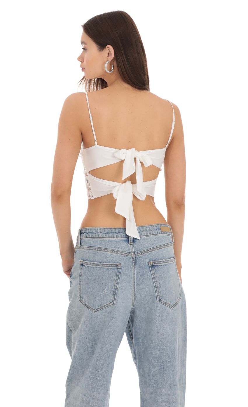 Picture Sequin Lace Crop Top in White. Source: https://media-img.lucyinthesky.com/data/Jan24/850xAUTO/a8081903-b6e3-4dd4-8f74-38fe81518201.jpg