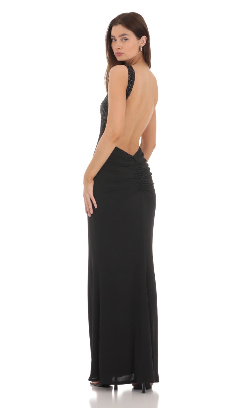 Picture Sequin Cross Neck Maxi Dress in Black. Source: https://media-img.lucyinthesky.com/data/Jan24/850xAUTO/b22f0d5d-d44d-4256-9633-2420fc429a31.jpg