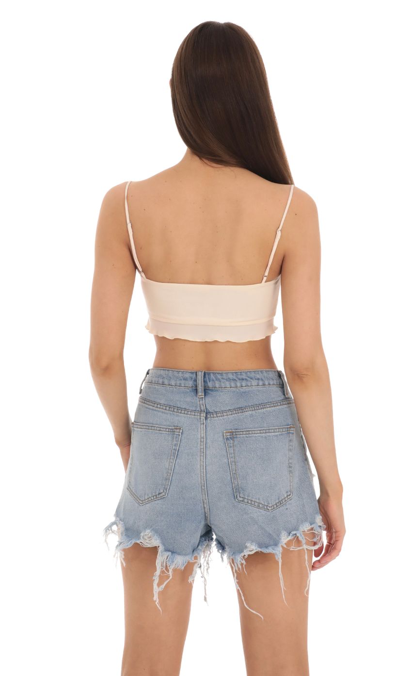 Picture Ruffle Crop Top in Light Peach. Source: https://media-img.lucyinthesky.com/data/Jan24/850xAUTO/b58244ab-9a23-48f4-ad23-27211c7f0e6f.jpg