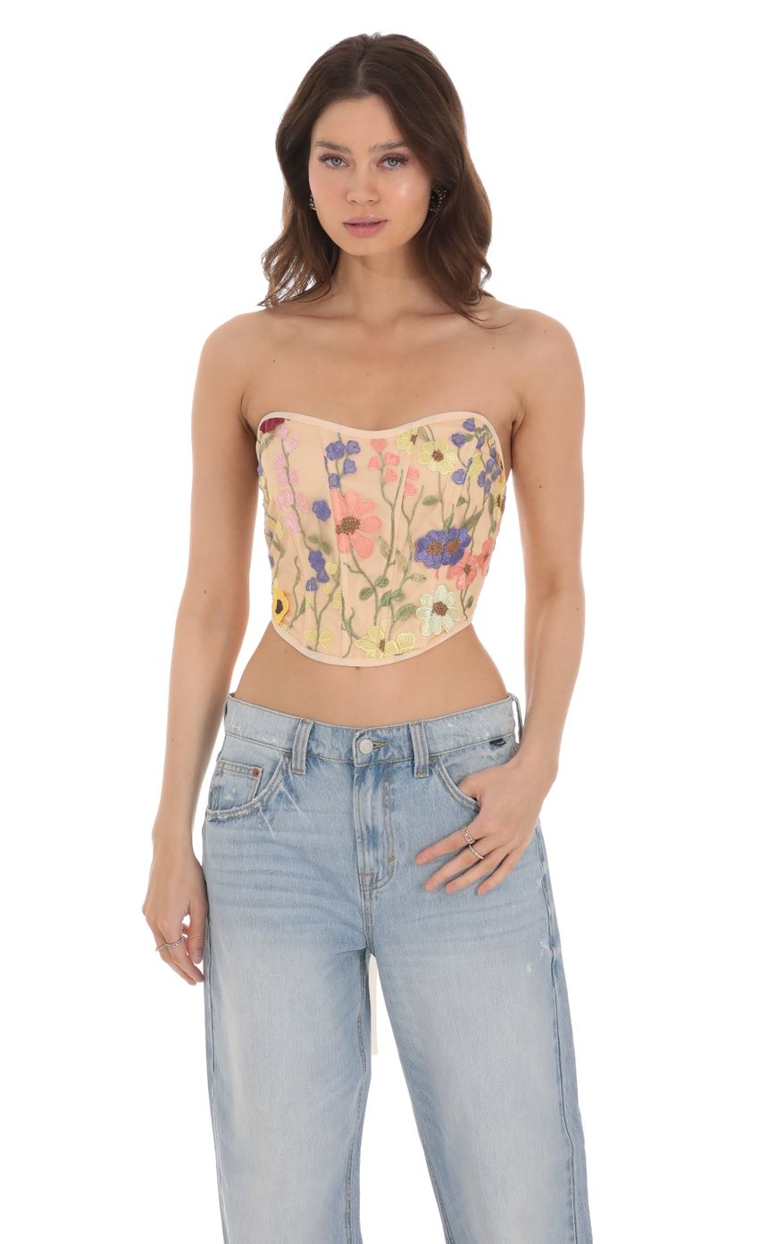 Picture Floral Embroidered Corset Top in Nude. Source: https://media-img.lucyinthesky.com/data/Jan24/850xAUTO/ba95aa7e-1b33-48d8-ba32-3a042d63f5c0.jpg