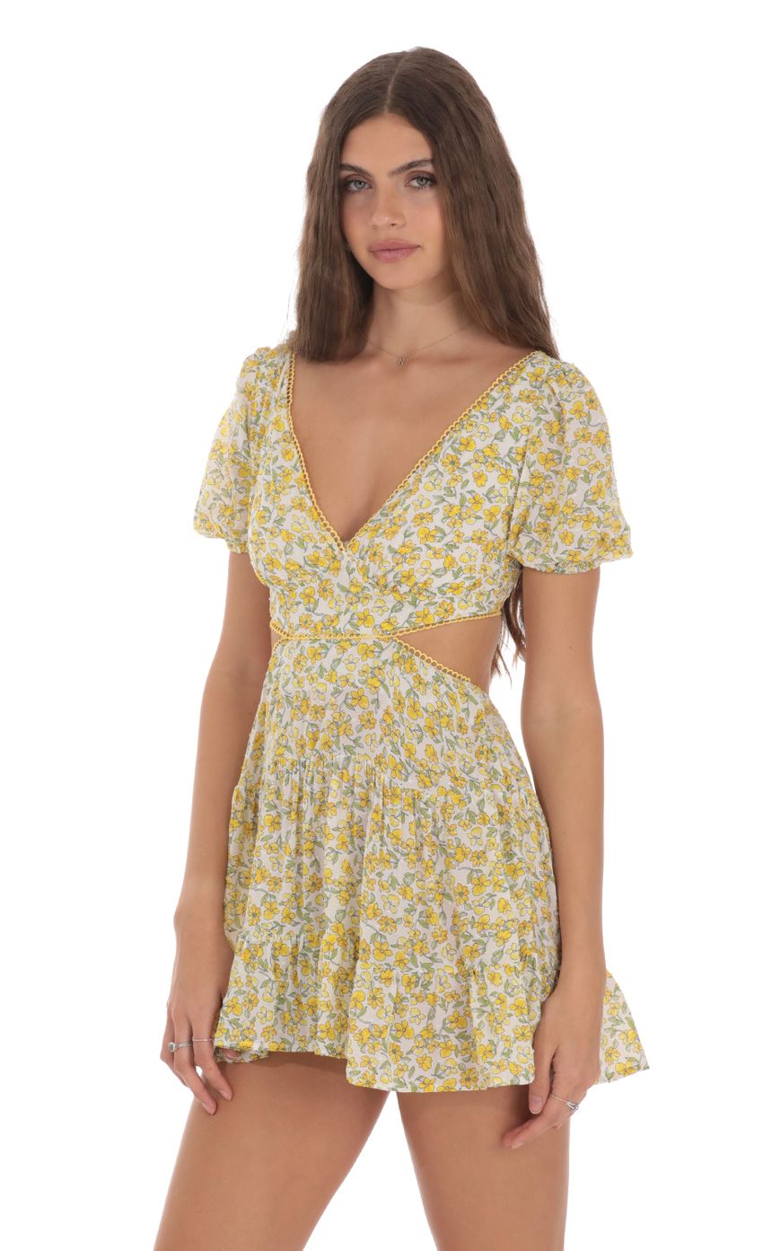 Picture Yellow Floral Cutout Dress in White. Source: https://media-img.lucyinthesky.com/data/Jan24/850xAUTO/c1b7fbde-e5b1-4149-afff-d34180c68cc2.jpg