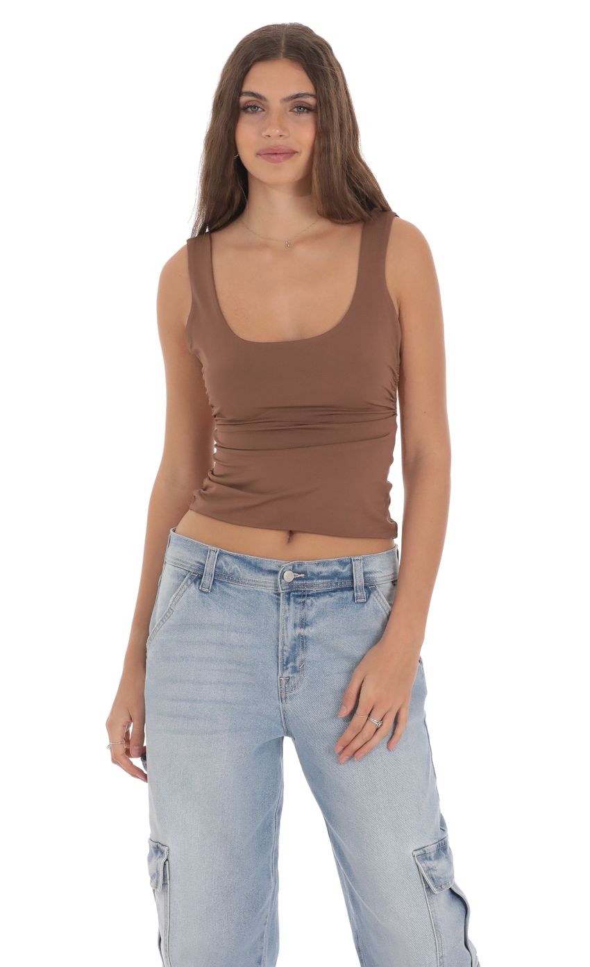 Picture Open Back Tank Top in Brown. Source: https://media-img.lucyinthesky.com/data/Jan24/850xAUTO/d3484dd6-a8f8-4847-a0e6-53d50163c46d.jpg
