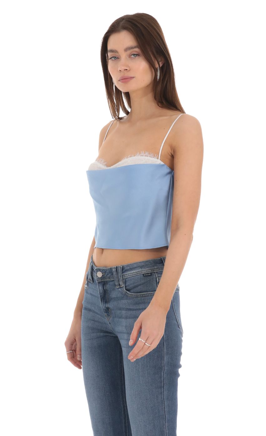 Picture Mesh Satin Top in Blue. Source: https://media-img.lucyinthesky.com/data/Jan24/850xAUTO/d83eb518-56f8-4165-9f13-376d7011886e.jpg