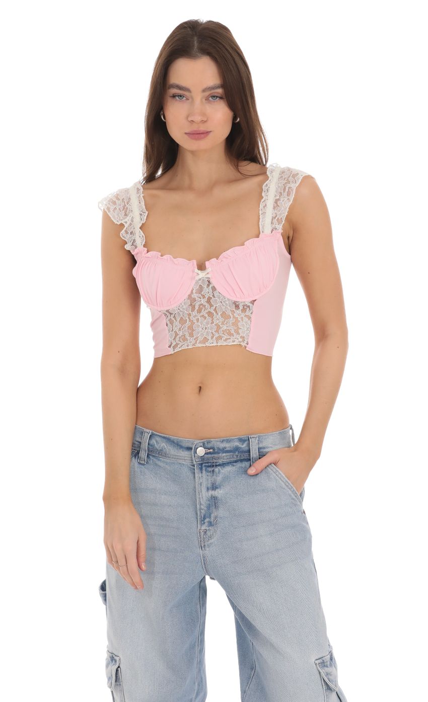 Picture Lace Cutout Top in Pink. Source: https://media-img.lucyinthesky.com/data/Jan24/850xAUTO/d851dc3f-dce3-47b3-818b-127734ec3a45.jpg
