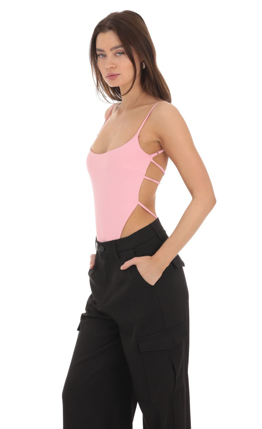 Picture Open Back Strappy Bodysuit in Pink. Source: https://media-img.lucyinthesky.com/data/Jan24/850xAUTO/da33178c-bdf6-4d0d-a54d-2e12022391b4.jpg