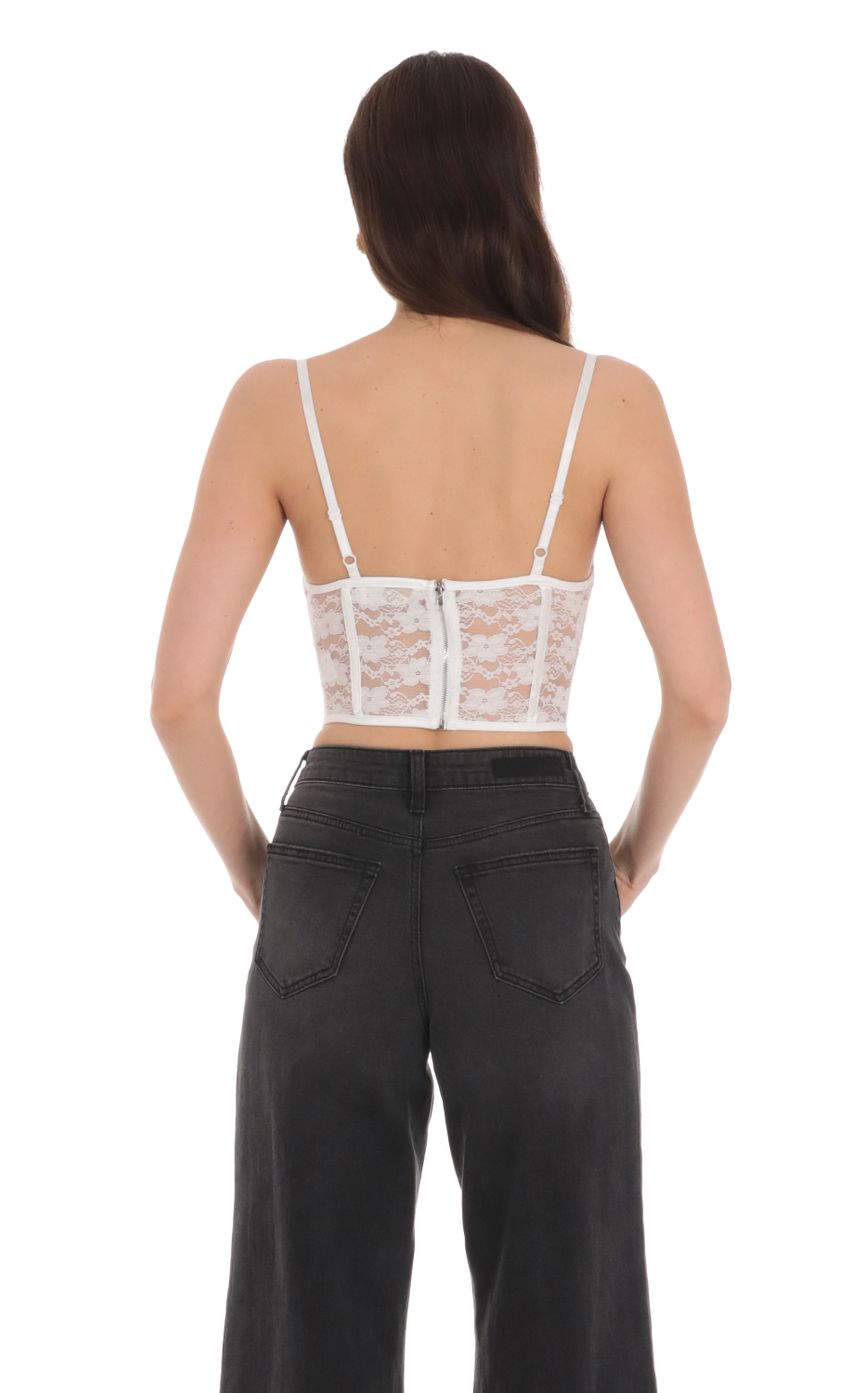 Picture Lace Satin Cutout Top in White. Source: https://media-img.lucyinthesky.com/data/Jan24/850xAUTO/e6509d90-f962-43f1-b495-541846f52582.jpg