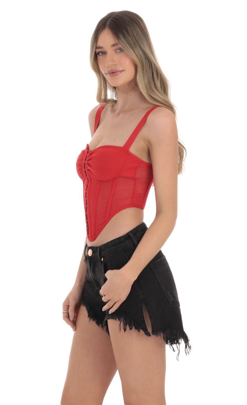 Picture Mesh Corset Top in Red. Source: https://media-img.lucyinthesky.com/data/Jan24/850xAUTO/eb14c522-f6f7-451a-86e8-cd97d536cfa5.jpg
