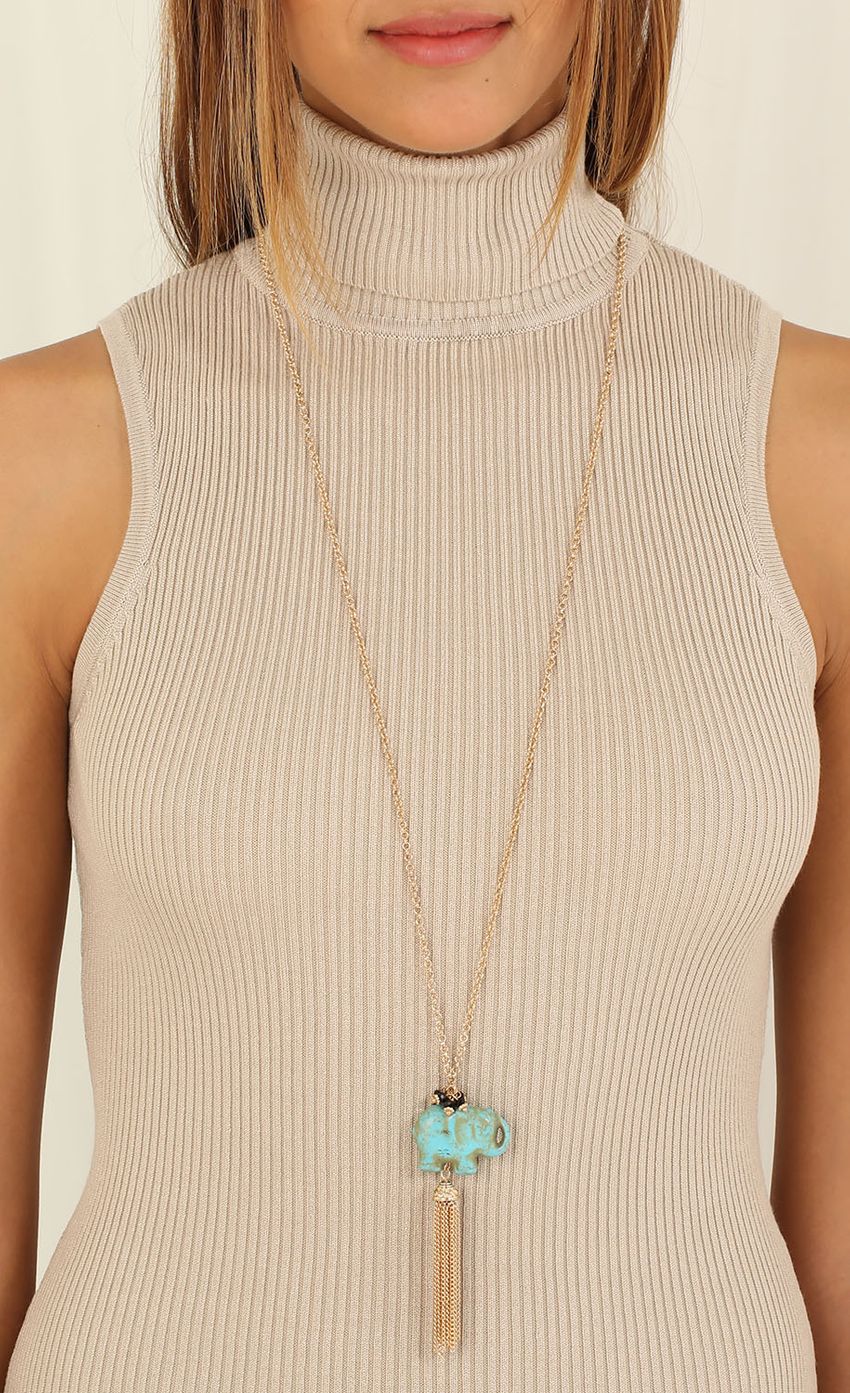 Picture Turquoise Elephant Dangle Necklace. Source: https://media-img.lucyinthesky.com/data/Jul15_1/850xAUTO/0Y5A0481.JPG