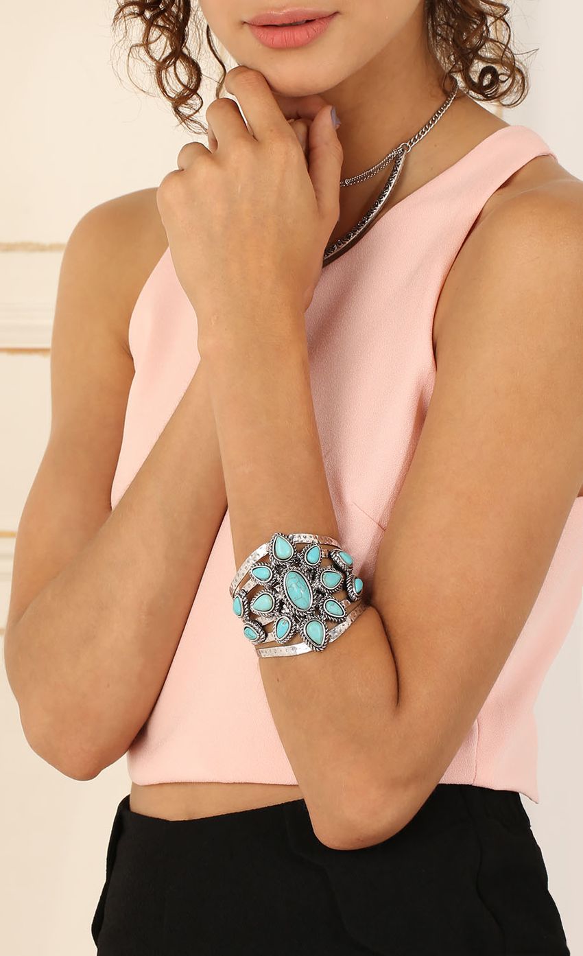 Picture Turquoise Flower Power Cuff. Source: https://media-img.lucyinthesky.com/data/Jul15_1/850xAUTO/0Y5A4845.JPG