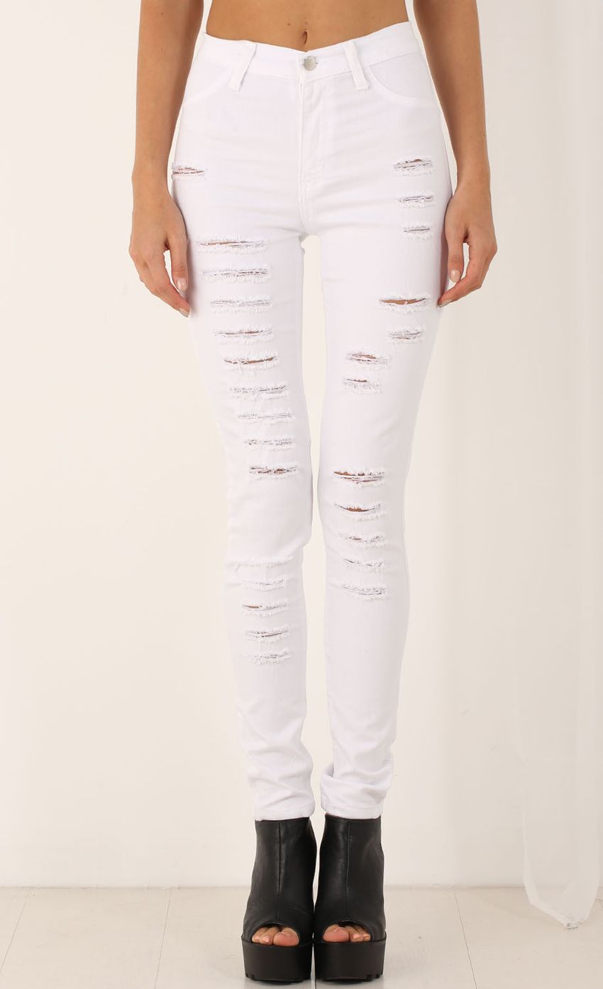 Picture Slashed Skinny Jeans In White. Source: https://media-img.lucyinthesky.com/data/Jul15_2/850xAUTO/0Y5A0288.JPG