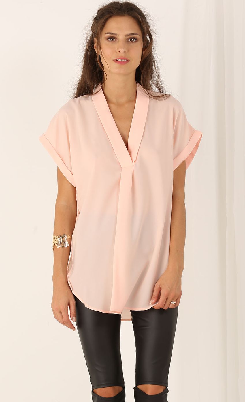 Picture Buttonless Blouse With Capped Sleeves In Pink. Source: https://media-img.lucyinthesky.com/data/Jul15_2/850xAUTO/0Y5A3082.JPG