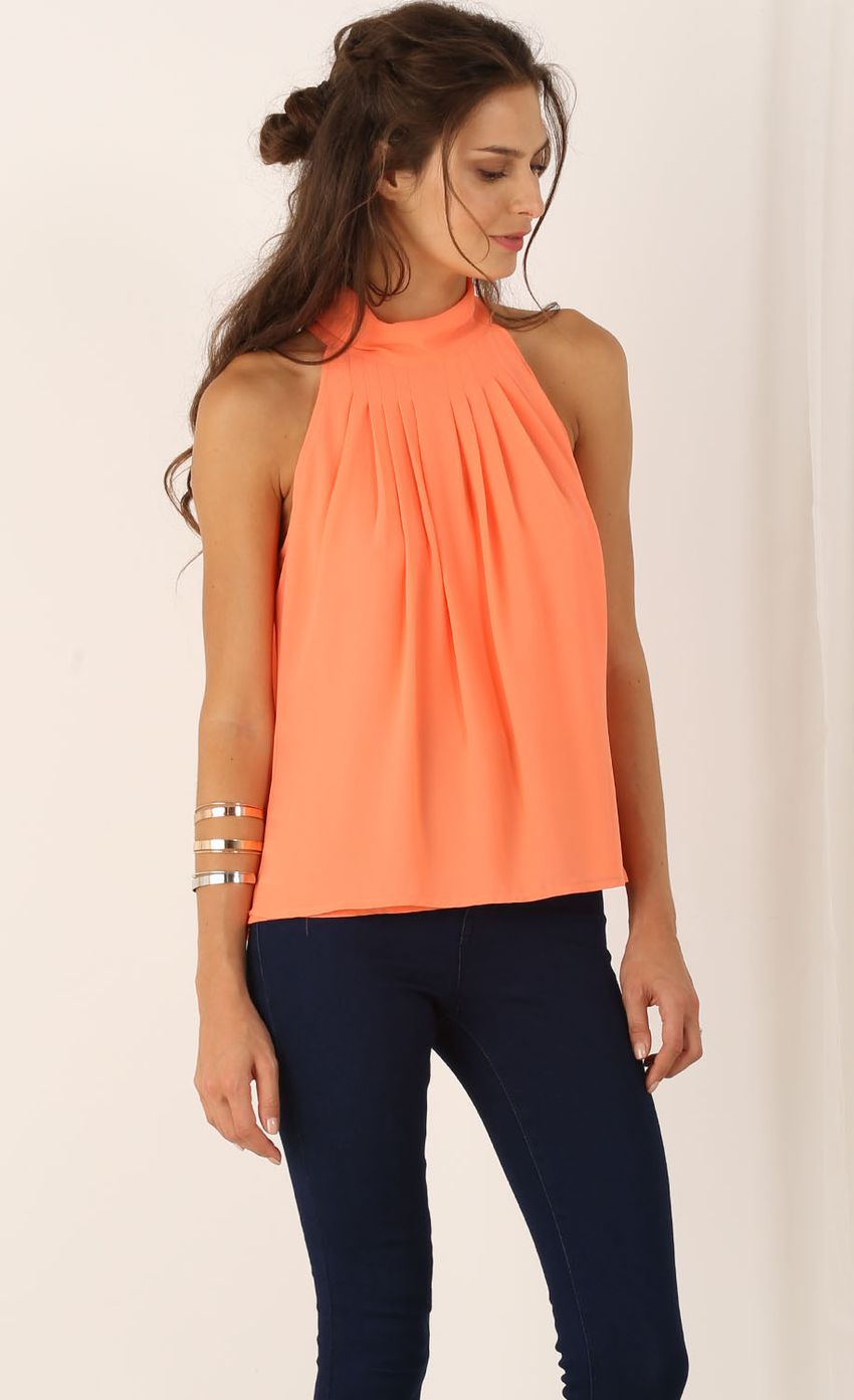Picture Sleeveless Pleated Top In Orange. Source: https://media-img.lucyinthesky.com/data/Jul15_2/850xAUTO/0Y5A3359.JPG
