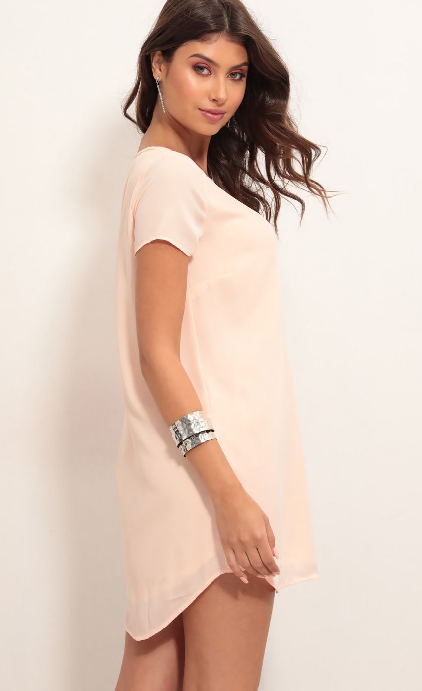 Picture Plunge Shift Dress in Light Coral. Source: https://media-img.lucyinthesky.com/data/Jul19_1/850xAUTO/781A3178.JPG
