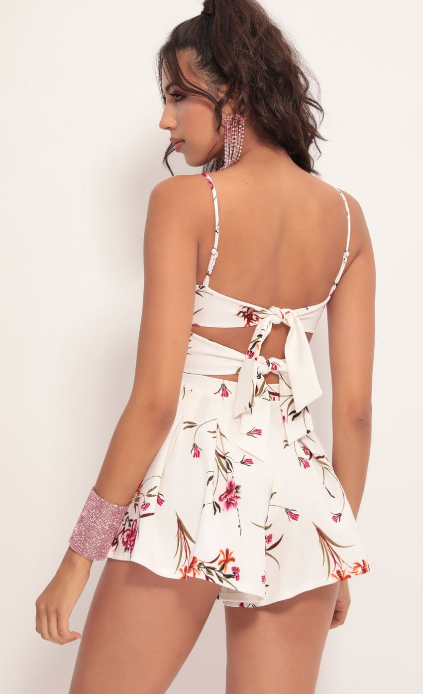Picture Cutout Romper in White Floral. Source: https://media-img.lucyinthesky.com/data/Jul19_2/850xAUTO/781A0897.JPG