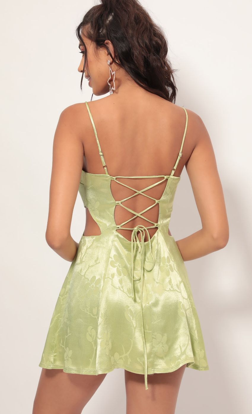 Picture Alani Diamond Cutout A-line Dress in Green Floral Satin. Source: https://media-img.lucyinthesky.com/data/Jul19_2/850xAUTO/781A4197.JPG
