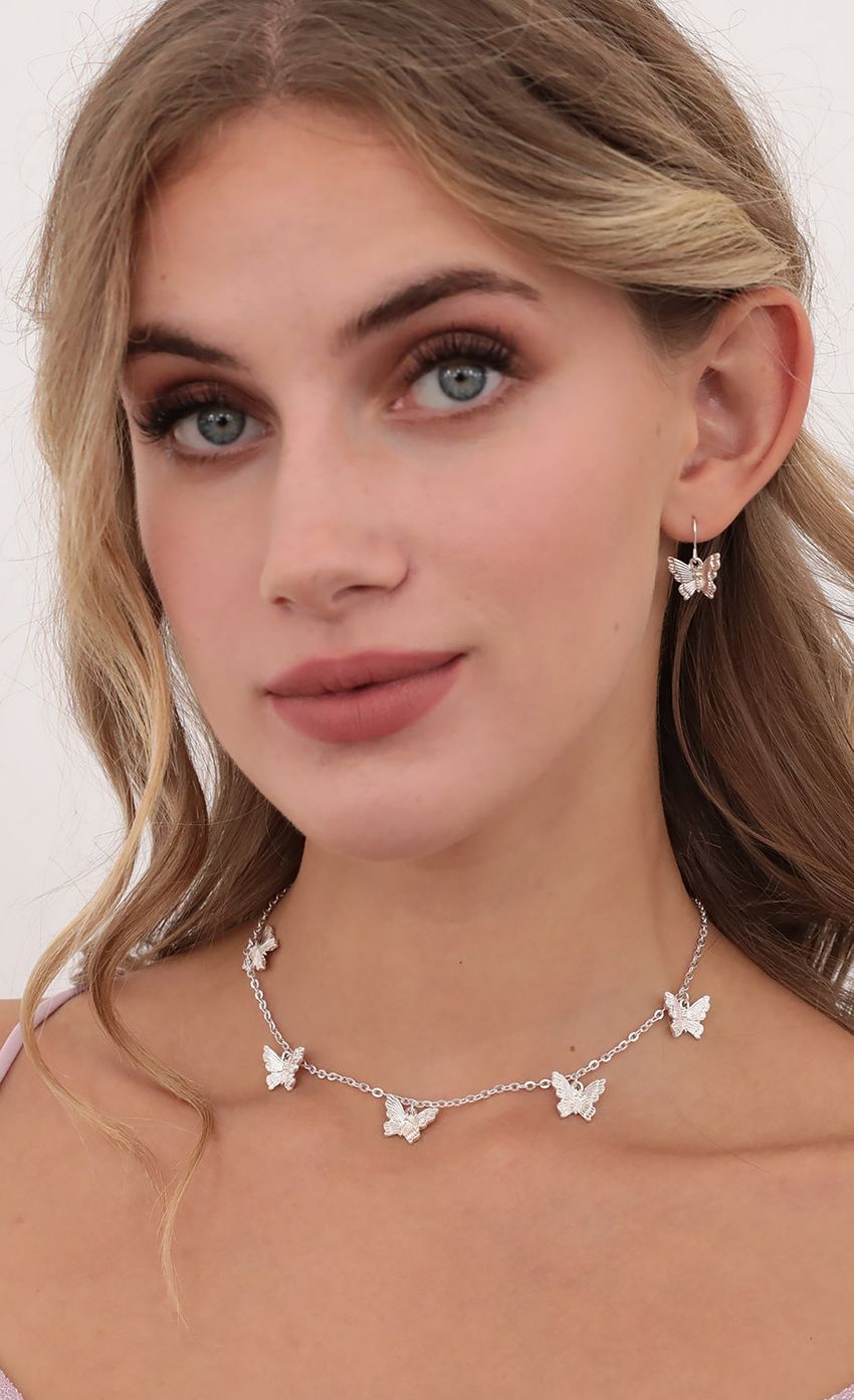 Picture Mini Silver Butterfly Charm Necklace &amp; Earrings. Source: https://media-img.lucyinthesky.com/data/Jul20_1/850xAUTO/781A1114.JPG