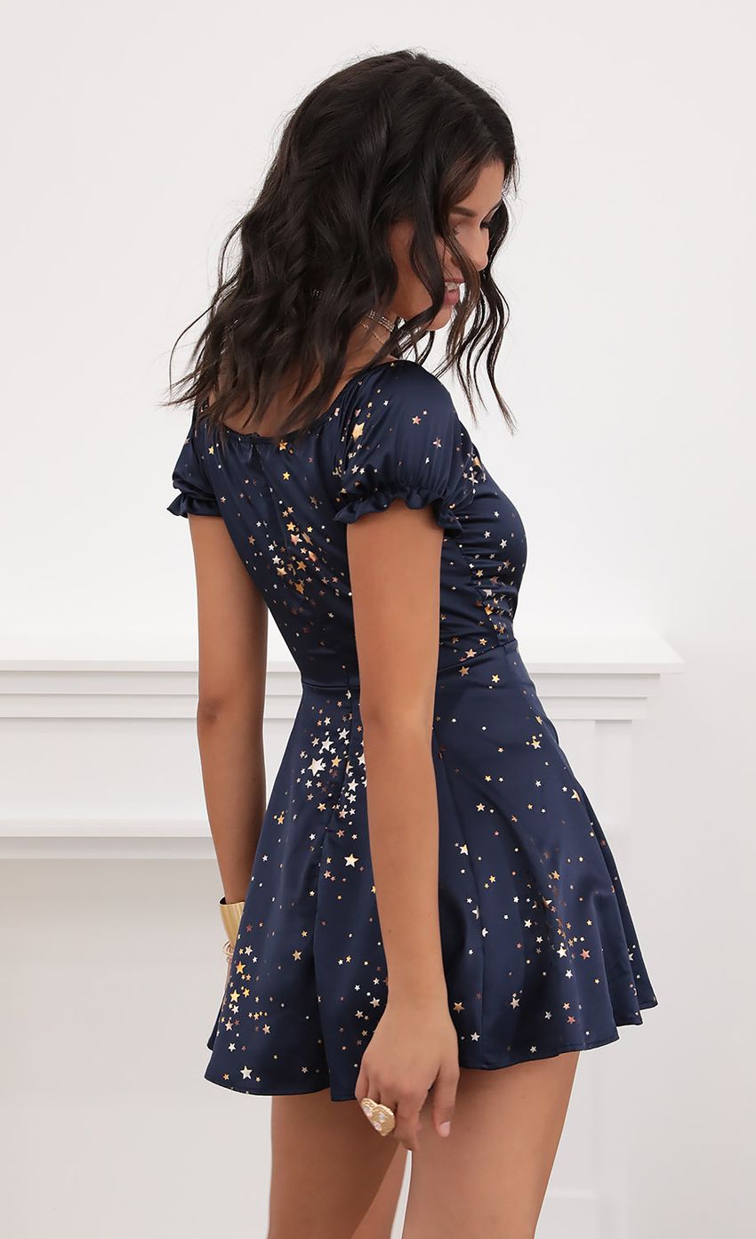 Picture Puff Sleeve Dress in Midnight Satin and Stars. Source: https://media-img.lucyinthesky.com/data/Jul20_2/850xAUTO/781A3611.JPG