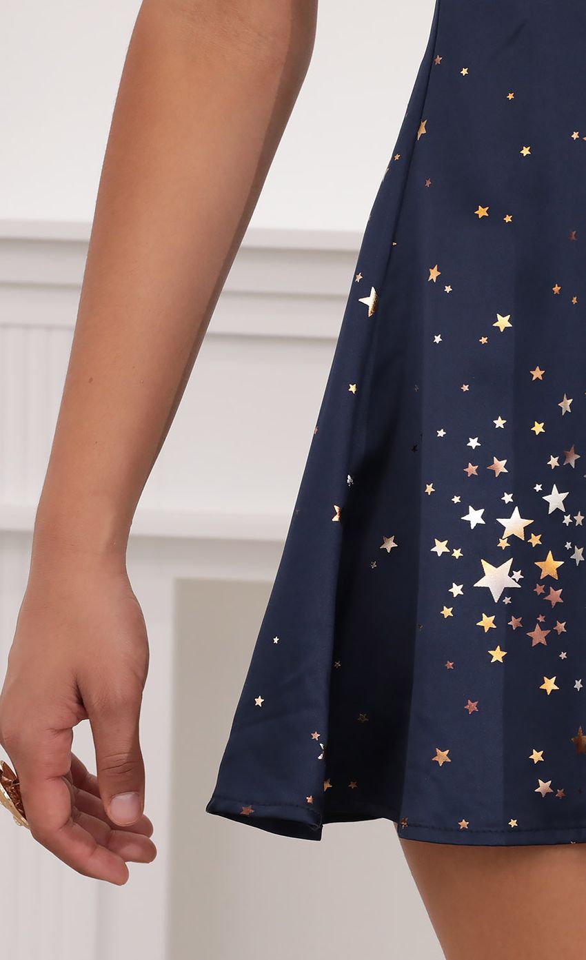 Picture Puff Sleeve Dress in Midnight Satin and Stars. Source: https://media-img.lucyinthesky.com/data/Jul20_2/850xAUTO/781A3618.JPG