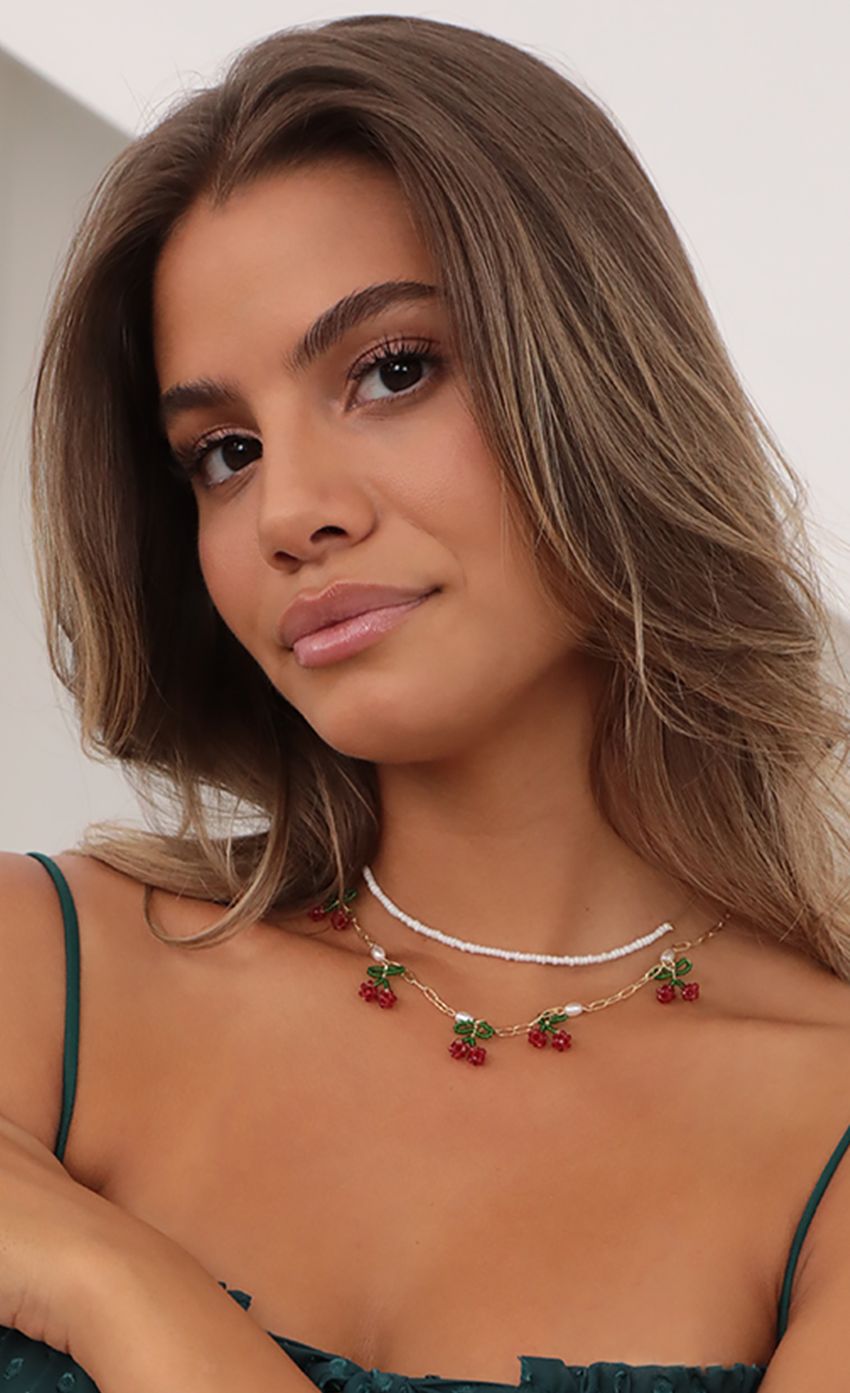 Picture Picking Cherries Layered Necklace in Gold. Source: https://media-img.lucyinthesky.com/data/Jul21_1/850xAUTO/AT2A1041_2.JPG