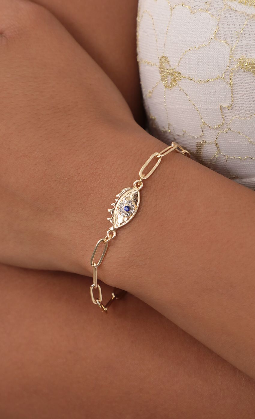 Picture No Bad Vibes Evil Eye Bracelet in Gold. Source: https://media-img.lucyinthesky.com/data/Jul21_1/850xAUTO/AT2A4803.JPG