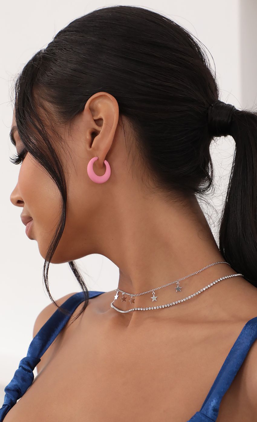 Picture Puff Princess Open Hoop Earring in Pink. Source: https://media-img.lucyinthesky.com/data/Jul21_1/850xAUTO/AT2A5315_COPY.JPG