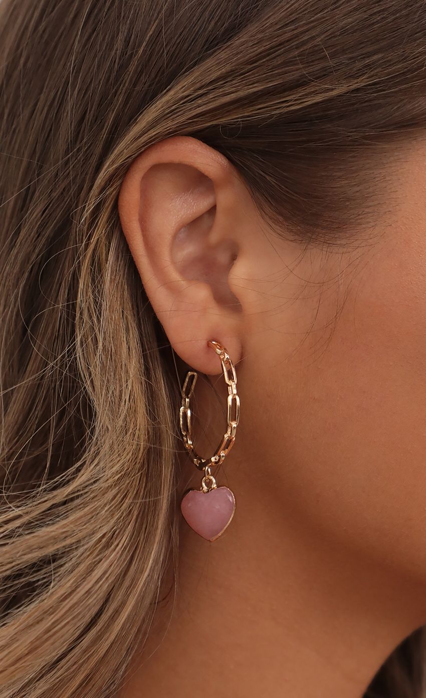 Picture Hanging Love Earrings in Gold. Source: https://media-img.lucyinthesky.com/data/Jul21_1/850xAUTO/AT2A9858.JPG