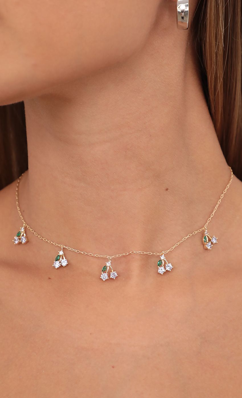 Picture White Cherry Blossom Necklace in Gold. Source: https://media-img.lucyinthesky.com/data/Jul21_2/850xAUTO/AT2A8576.JPG