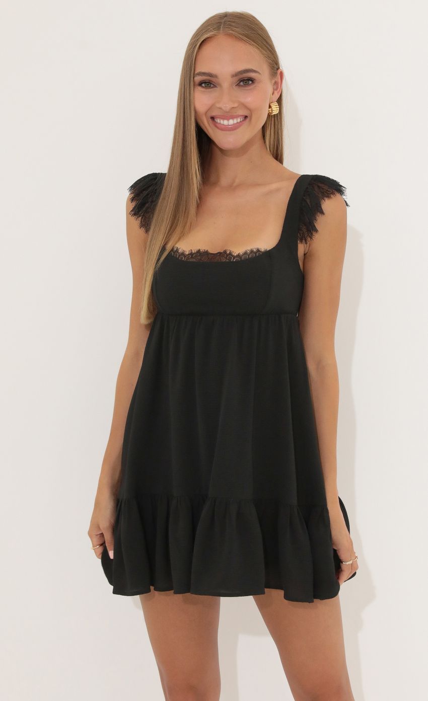 Picture Michele Crepe Ruffle Baby Doll Dress in Black. Source: https://media-img.lucyinthesky.com/data/Jul22_1/850xAUTO/1V9A7369.JPG
