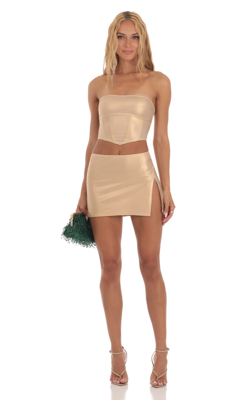 Picture Faux Leather Two Piece Skirt Set in Gold. Source: https://media-img.lucyinthesky.com/data/Jul23/850xAUTO/93ca1134-1d4d-4886-a7f0-3e317ae725aa.jpg