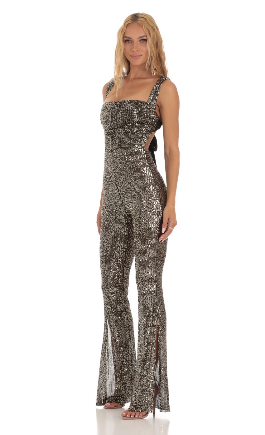 Picture Gold Sequin Back Bow Tie Jumpsuit in Black. Source: https://media-img.lucyinthesky.com/data/Jul23/850xAUTO/f52beb0c-b712-4f81-8bd1-631079b20440.jpg