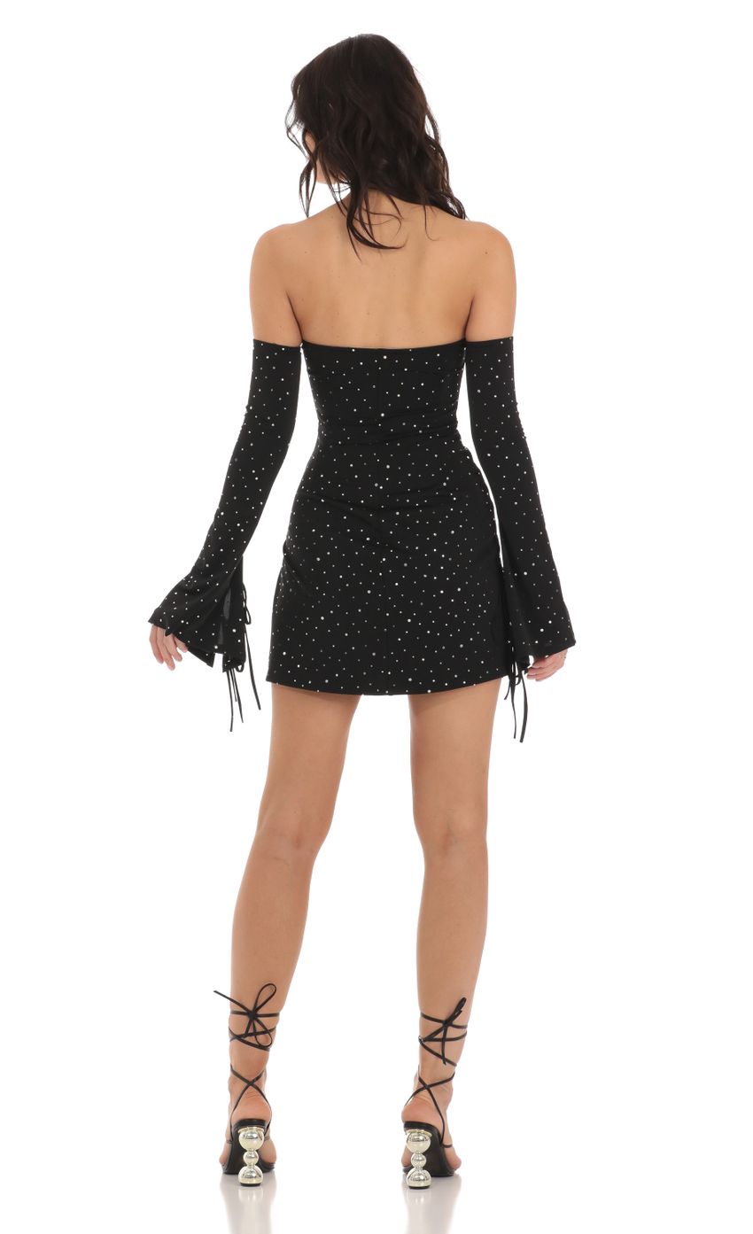 Picture Ina Shimmer Bell Sleeve Dress in Black. Source: https://media-img.lucyinthesky.com/data/Jul23/850xAUTO/f6a8d443-972d-4e63-87e4-df13e80b8718.jpg