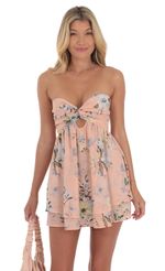 Picture Floral Shimmer Cutout Babydoll Dress in Pink. Source: https://media-img.lucyinthesky.com/data/Jul24/150xAUTO/001143cd-a87b-4c80-a6a7-c4b6a34a0453.jpg