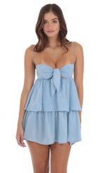 Picture Satin Ruffle Front Tie Dress in Blue. Source: https://media-img.lucyinthesky.com/data/Jul24/150xAUTO/10da226f-f4d0-40b9-b8b1-bda36e0d32a4.jpg