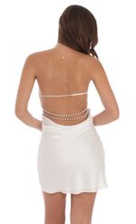 Picture Satin Pearl Open Back Dress in White. Source: https://media-img.lucyinthesky.com/data/Jul24/150xAUTO/cfdda449-f9b9-41da-93ad-e18d46b8690a.jpg