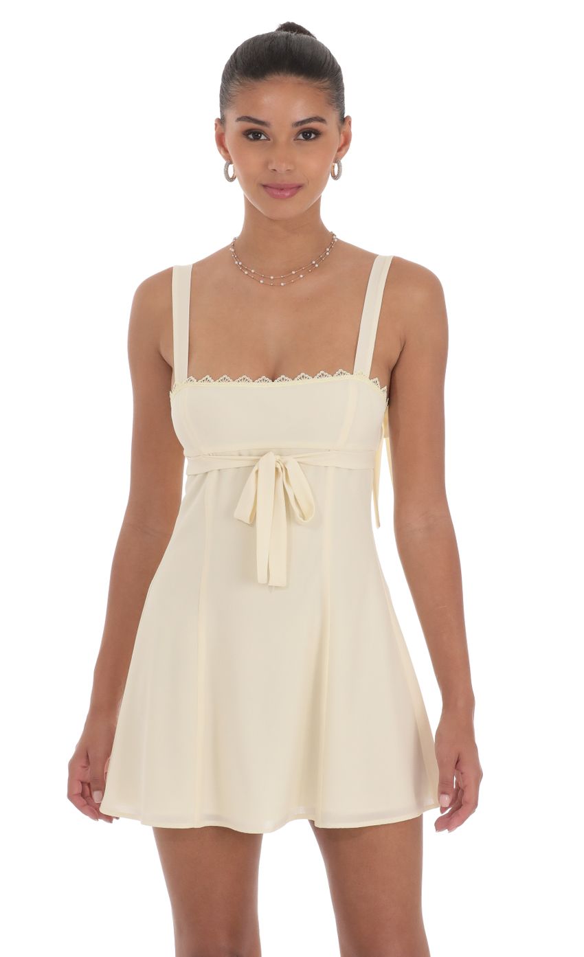 Picture Ribbon Embroidered Trim Dress in Cream. Source: https://media-img.lucyinthesky.com/data/Jul24/850xAUTO/20ee2619-45fc-4099-8d8c-53a85810b5d8.jpg