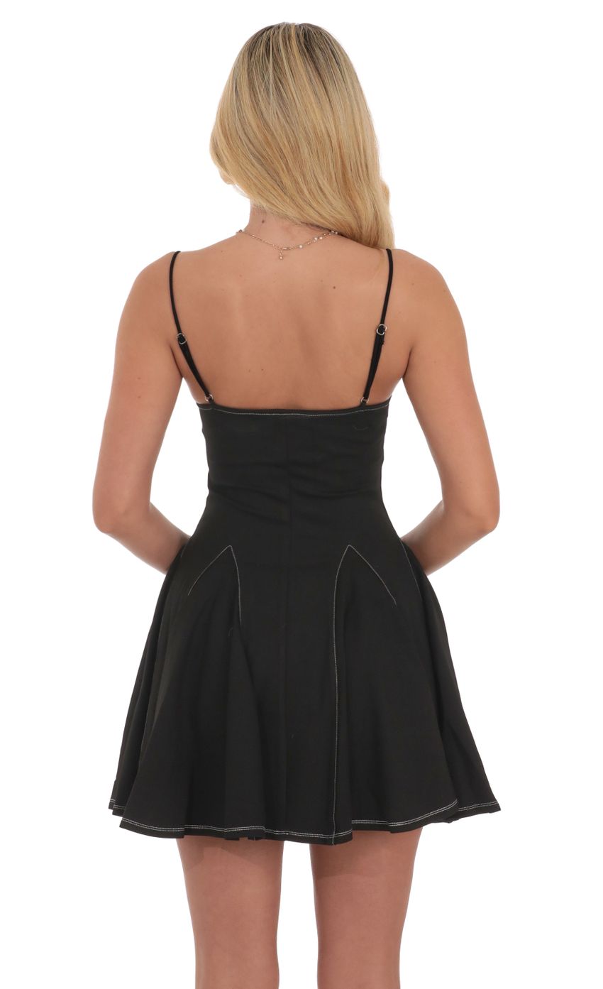 Picture White Stitch Fit and Flare Dress in Black. Source: https://media-img.lucyinthesky.com/data/Jul24/850xAUTO/34bfbefa-6299-4ed3-9903-6a64117f44b8.jpg