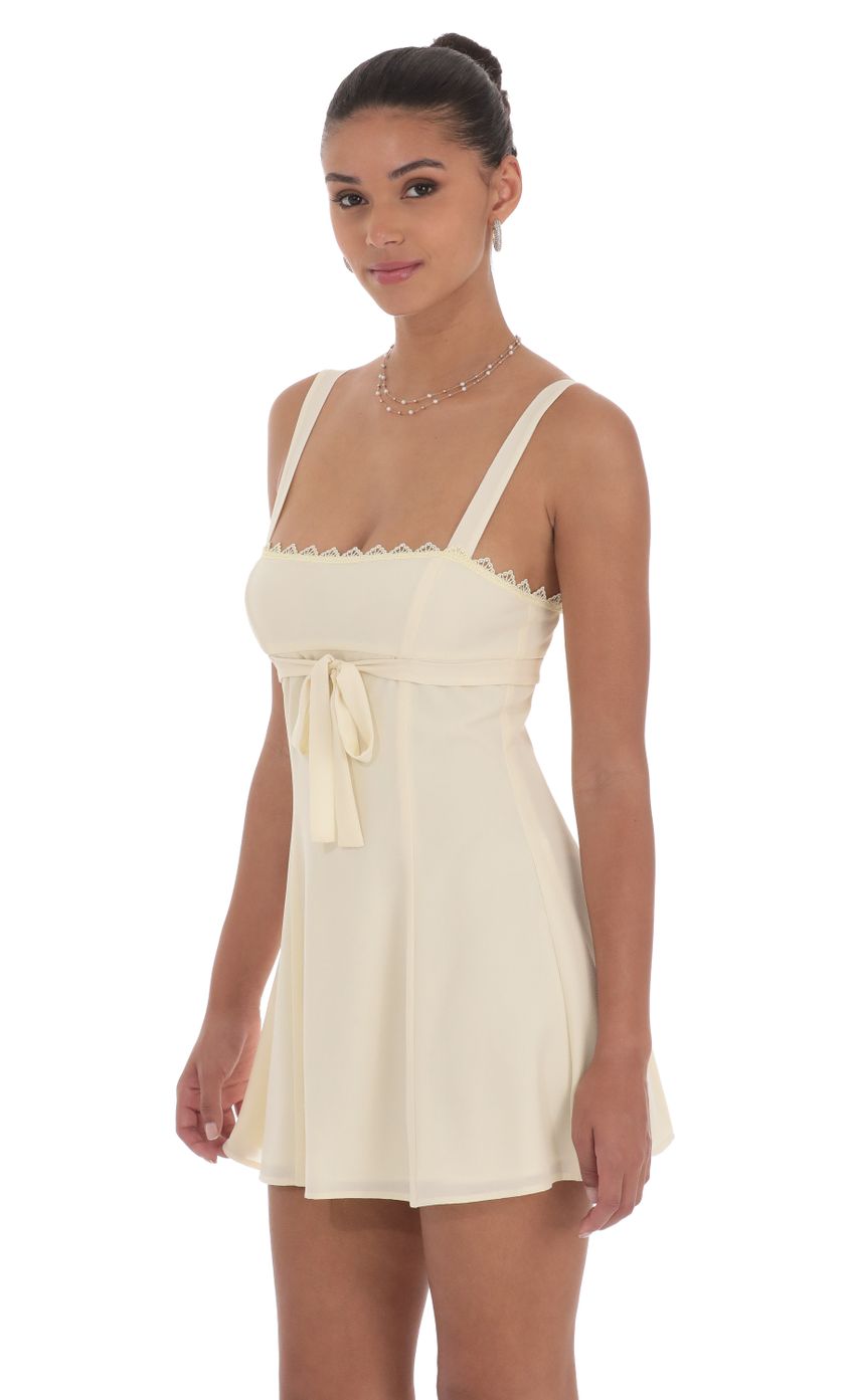 Picture Ribbon Embroidered Trim Dress in Cream. Source: https://media-img.lucyinthesky.com/data/Jul24/850xAUTO/56550e92-12eb-4169-95ca-799e9ae4386c.jpg