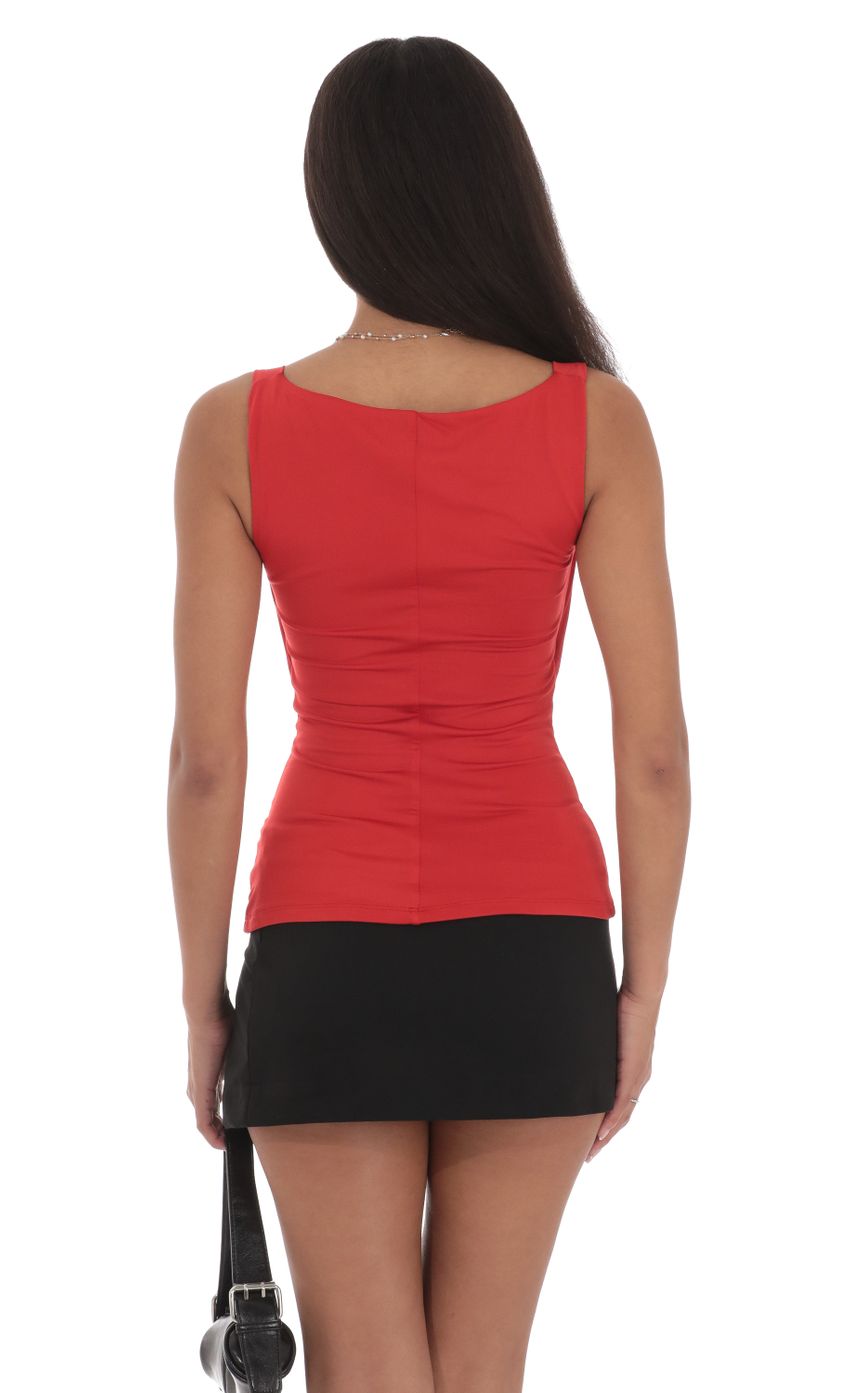 Picture Plunge Cutout Top in Red. Source: https://media-img.lucyinthesky.com/data/Jul24/850xAUTO/6a124572-80c5-42be-a3b7-1043eb2f587c.jpg