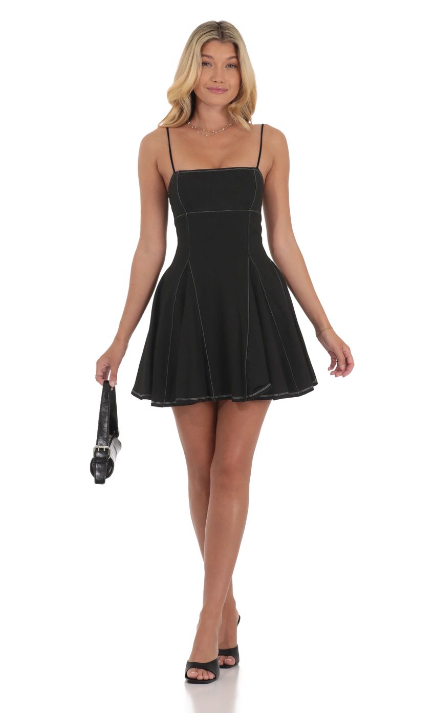 Picture White Stitch Fit and Flare Dress in Black. Source: https://media-img.lucyinthesky.com/data/Jul24/850xAUTO/97a38b1d-fdc0-4d47-836f-0a4495ce12f7.jpg