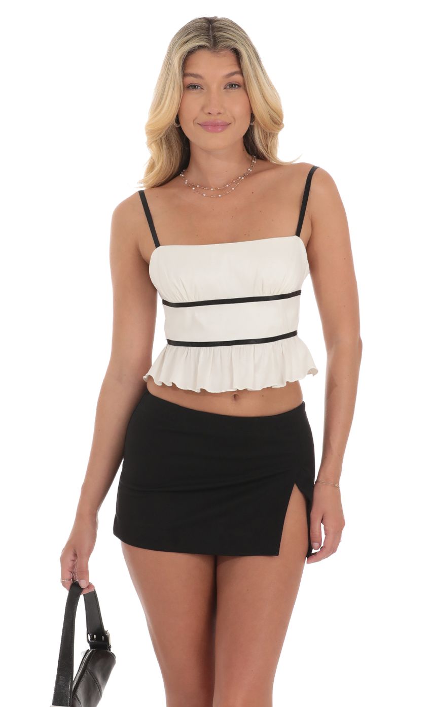 Picture Striped Open Back Top in White. Source: https://media-img.lucyinthesky.com/data/Jul24/850xAUTO/b12560d4-8c83-4f1f-8d15-e0239f8b840c.jpg