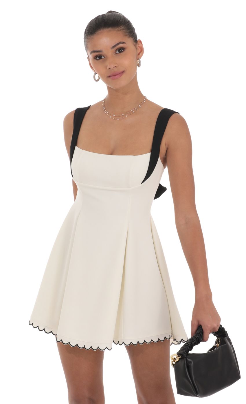 Picture Scallop Hem Fit and Flare Dress in White. Source: https://media-img.lucyinthesky.com/data/Jul24/850xAUTO/daf0adf4-1116-4e1f-a21a-1fc033bc3efd.jpg