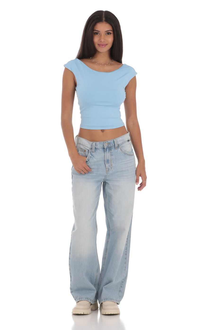 Picture High Neck Open Back Top in Light Blue. Source: https://media-img.lucyinthesky.com/data/Jul24/850xAUTO/e2966ab5-2979-49f4-ab98-7f812601a134.jpg