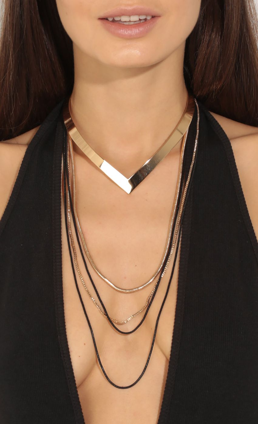 Picture Layered Metal Choker Necklace In Gold. Source: https://media-img.lucyinthesky.com/data/Jun16_1/850xAUTO/0Y5A9057.JPG