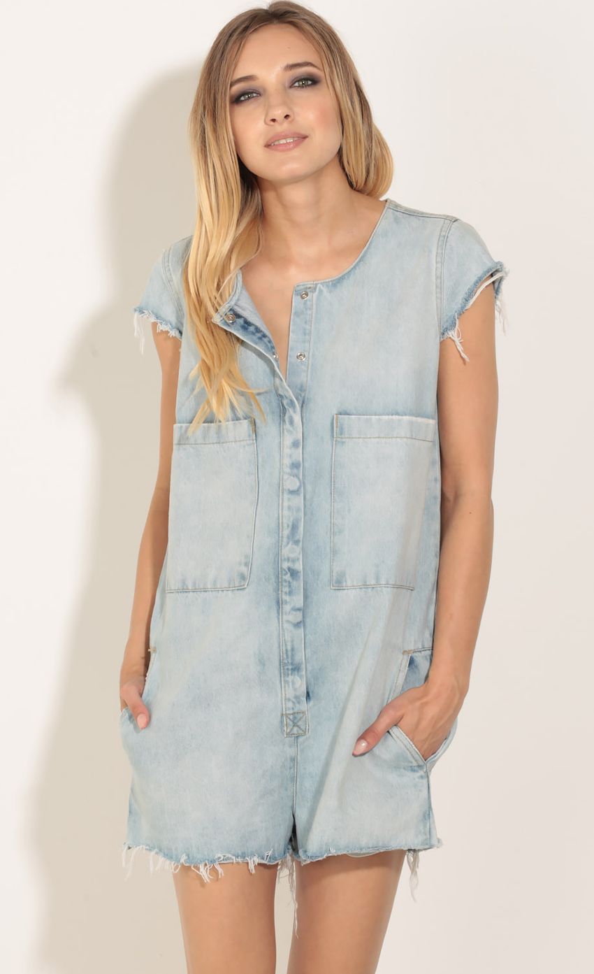 Picture Distressed Denim Romper In Light Blue. Source: https://media-img.lucyinthesky.com/data/Jun16_1/850xAUTO/0Y5A9200.JPG