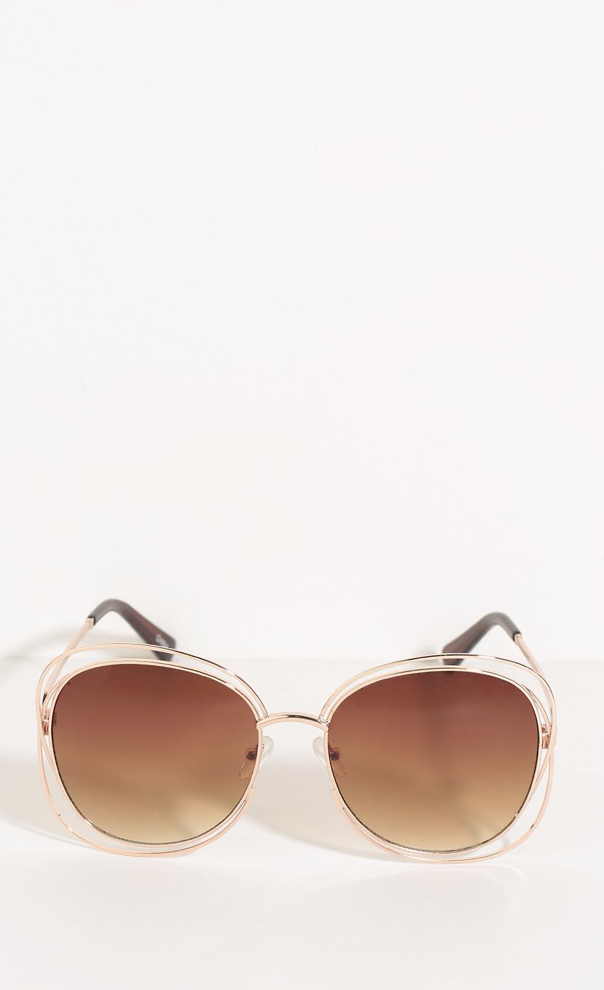 Picture Round Wire Wrap Sunglasses In Sienna. Source: https://media-img.lucyinthesky.com/data/Jun16_2/850xAUTO/0Y5A5253.JPG