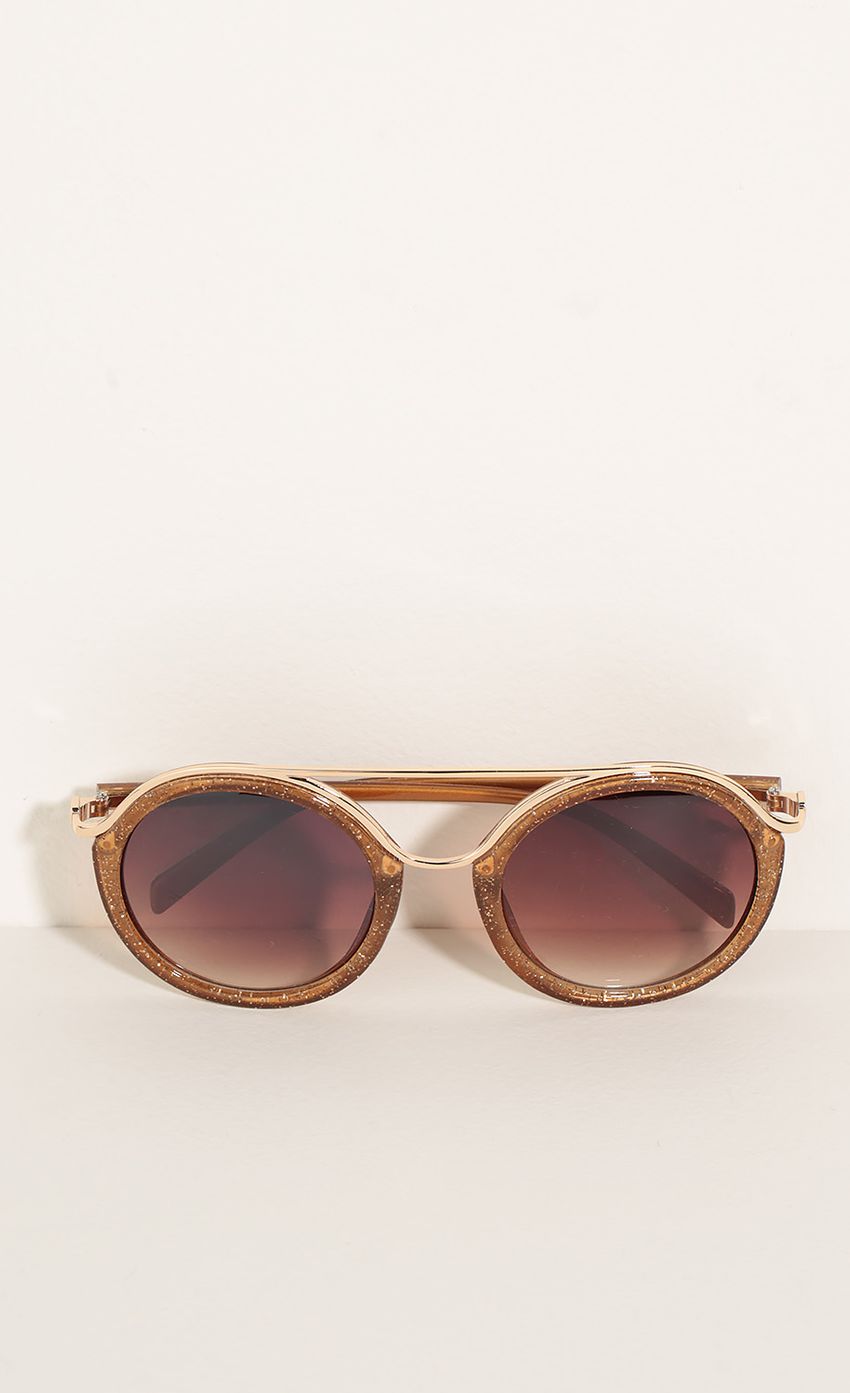 Picture Round Sunglasses In Orange Glitter. Source: https://media-img.lucyinthesky.com/data/Jun16_2/850xAUTO/0Y5A6376.JPG