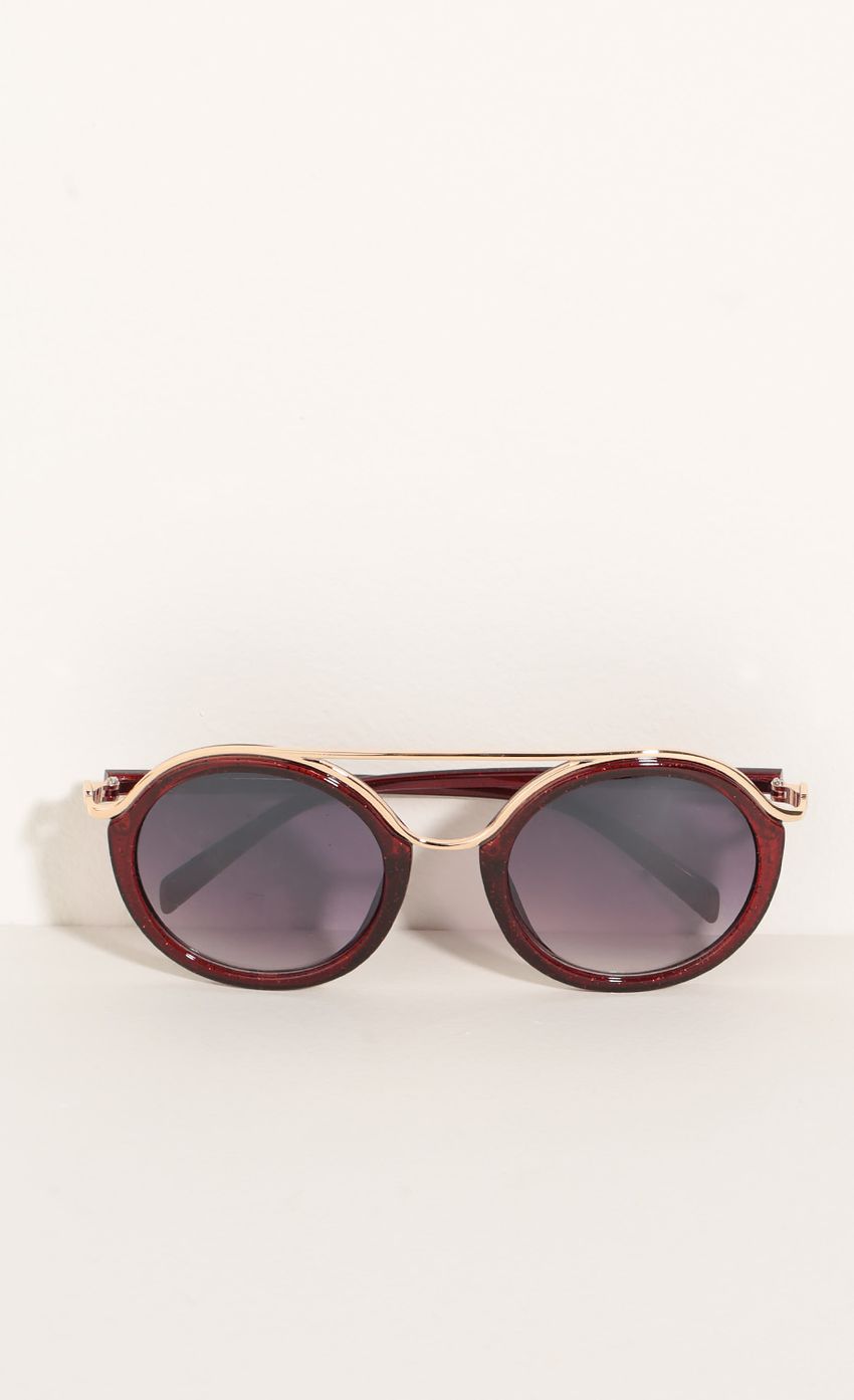 Picture Round Sunglasses In Glitter Red. Source: https://media-img.lucyinthesky.com/data/Jun16_2/850xAUTO/0Y5A6406.JPG